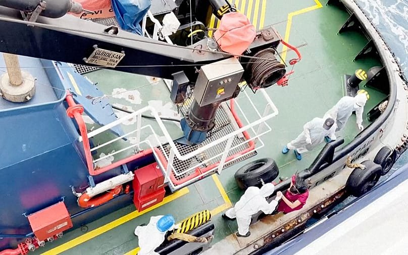 Health workers get off the Dutch-flagged MV Hondius off Cape Verde, 4 May, 2026