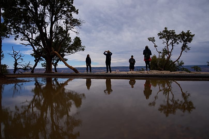 People stand at the rim of the Grand Canyon, 31 August, 2026