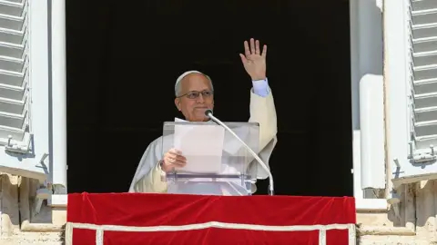 Getty Images The Pope delivering a speech from a windowsill on Sunday