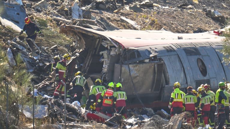 Emergency services work at the scene of a collision between two trains in Urda, Spain, on Wednesday, Oct. 28, 2026.